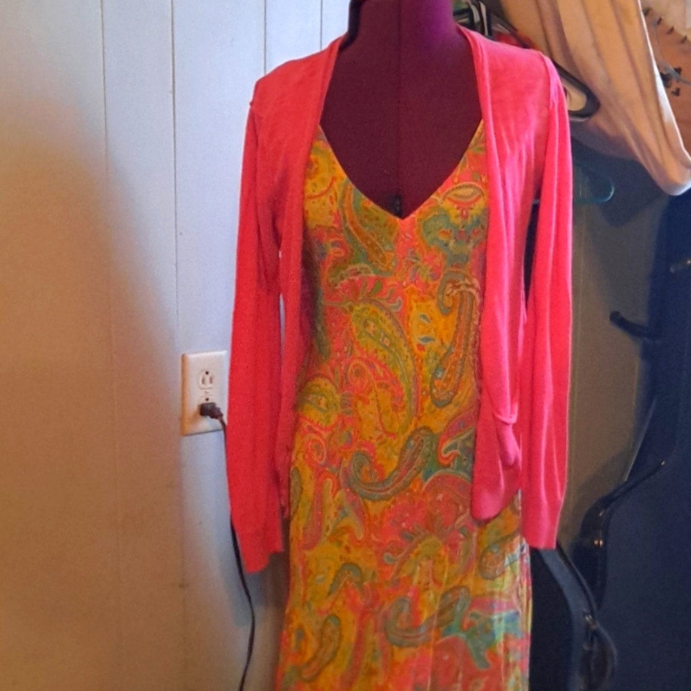 A beautiful multicolor spring dress by Ralph Lauren paired with a pink sweater.